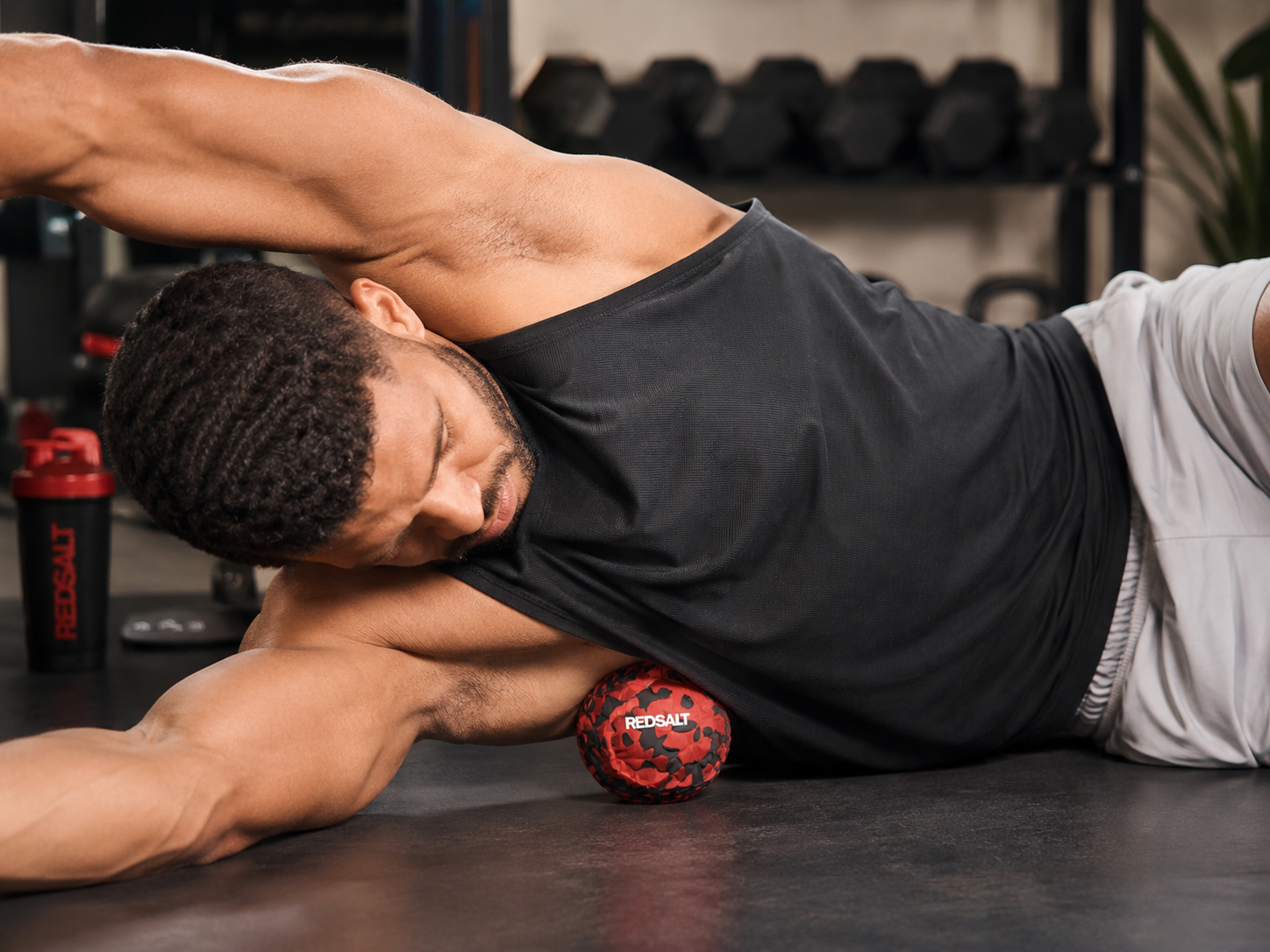 A man demonstrating massage ball use
